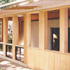 Custom carpentry to enclose open porch with aluminum windows