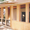 Custom carpentry to enclose open porch with aluminum windows